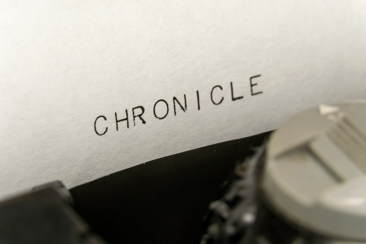 Close up printed text Chronicle on an old typewriter